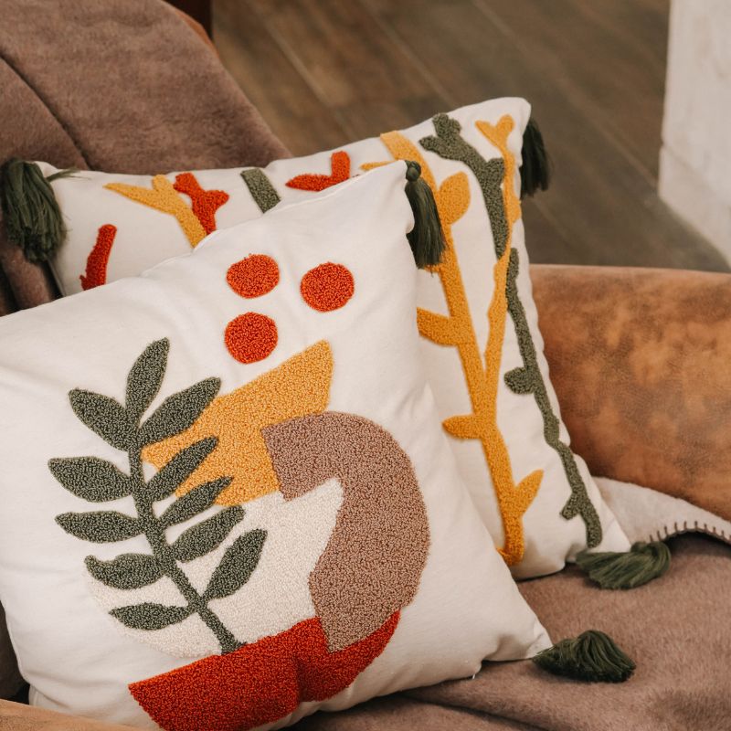 Abstract Garden Collection square cushion cover with embroidered stems in red, mustard yellow, and olive green, finished with green tassels – 43x43 cm decorative pillow