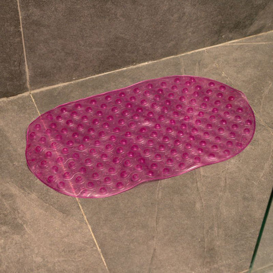 Lilac anti-slip capsule rubber shower mat on gray tiled bathroom floor