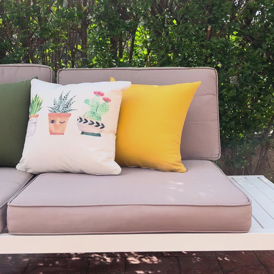 Cute watercolor cactus cushion cover with small potted plants on minimalist white decorative pillow