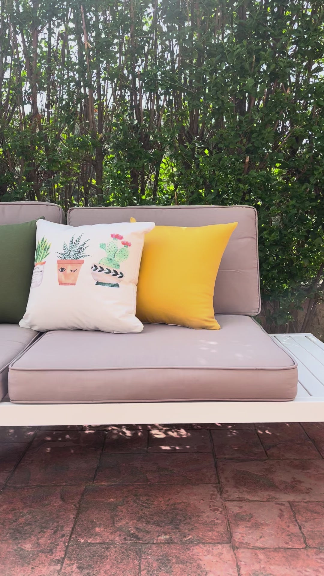 Cute watercolor cactus cushion cover with small potted plants on minimalist white decorative pillow