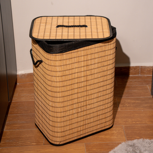 Rectangle bamboo laundry basket with lid and black fabric lining.