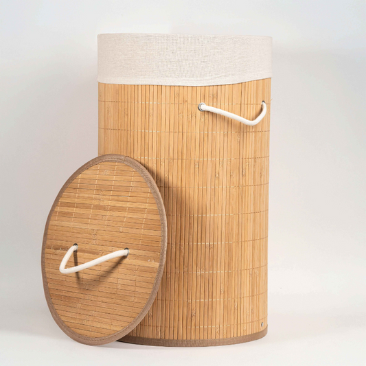 Round bamboo laundry basket with lid and off-white fabric lining.