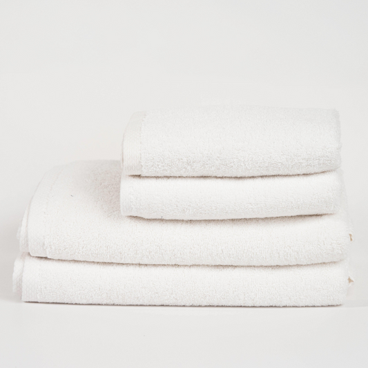 Absorbent soft white cotton towel folded neatly.