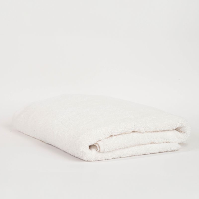 Main Bundle Image: “White bathroom essentials bundle with bamboo laundry basket, pure white towels, white bath mat, and transparent anti-slip mat.”