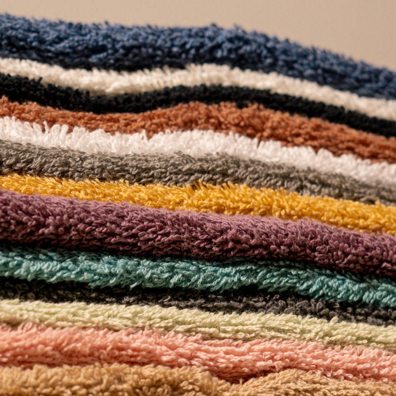 Absorbent soft white cotton towel folded neatly.