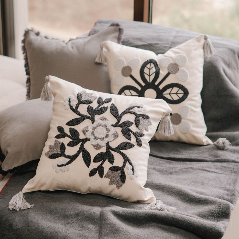 Timeless Collection square embroidered cushion cover in navy and grey petal motif with light grey tassels – 43x43 cm
